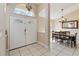 Bright foyer with tiled floors, a double door entrance, high ceilings, and an adjacent dining area at 2706 Sebastian Ct, Kissimmee, FL 34743