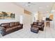 Open concept living space with tile floors, high ceilings, comfortable seating, and a bar area nearby at 2706 Sebastian Ct, Kissimmee, FL 34743