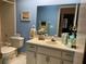 Cozy bathroom with a neutral color scheme and a well-lit vanity area at 2809 Wingfoot Ct, Winter Haven, FL 33884
