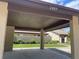Carport area with well-maintained landscaping, providing covered parking and enhancing the curb appeal of the property at 2809 Wingfoot Ct, Winter Haven, FL 33884