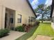 Charming home featuring stucco exterior, colorful landscaping, and a well-manicured lawn at 2809 Wingfoot Ct, Winter Haven, FL 33884