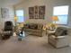 Comfortable living room features natural light, neutral furniture, and inviting decor at 2809 Wingfoot Ct, Winter Haven, FL 33884
