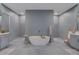 Luxurious bathroom featuring a freestanding tub, dual showers, and elegant decor at 3409 Lake Diane Rd, Tavares, FL 32778
