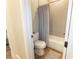 A bathroom featuring wood look floors and a shower and tub combo with tile surround at 3409 Lake Diane Rd, Tavares, FL 32778