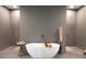 Modern bathroom showcasing a freestanding tub, dual walk-in showers, and designer finishes at 3409 Lake Diane Rd, Tavares, FL 32778
