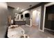 A luxurious bathroom features a soaking tub, walk-in shower, and gray cabinets at 3409 Lake Diane Rd, Tavares, FL 32778
