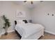 Bright bedroom with light wood flooring, a ceiling fan, and a modern aesthetic at 3409 Lake Diane Rd, Tavares, FL 32778