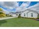 Stunning modern farmhouse with brick drive, manicured lawn, and three-car garage at 3409 Lake Diane Rd, Tavares, FL 32778