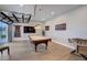 Spacious game room with a pool table, foosball, and a billiards lounge sign, perfect for entertaining guests at 3409 Lake Diane Rd, Tavares, FL 32778