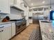 Beautiful kitchen with stainless steel appliances, custom cabinets, and granite countertops at 3409 Lake Diane Rd, Tavares, FL 32778