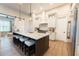 Modern kitchen featuring a large center island with seating and stainless steel appliances at 3409 Lake Diane Rd, Tavares, FL 32778