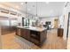 Modern kitchen featuring stainless steel appliances, a large island, and an open floor plan at 3409 Lake Diane Rd, Tavares, FL 32778