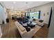 Spacious living room open to the kitchen, with multiple seating areas and access to the pool at 3409 Lake Diane Rd, Tavares, FL 32778