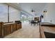 A spacious outdoor patio with a dining table and chairs, seamlessly connecting to the pool area with beautiful views at 3409 Lake Diane Rd, Tavares, FL 32778