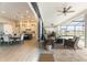 Open concept: patio and kitchen blend seamlessly for indoor-outdoor living with tranquil pool and lawn view at 3409 Lake Diane Rd, Tavares, FL 32778
