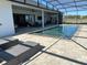 Inviting pool with comfortable lounge chairs, surrounded by a screened enclosure offering privacy and relaxation at 3409 Lake Diane Rd, Tavares, FL 32778