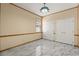Neutral bedroom features stylish tile flooring, neutral paint, and double closets at 3637 Rothbury Dr, Belle Isle, FL 32812