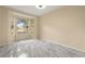 Empty bedroom with a bay window and tile flooring at 3637 Rothbury Dr, Belle Isle, FL 32812