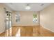 Bright bedroom with hardwood floors, natural light, and sliding glass doors to the pool area at 3637 Rothbury Dr, Belle Isle, FL 32812