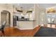 Open-concept kitchen flowing into the dining area, featuring modern appliances and stylish design elements at 3637 Rothbury Dr, Belle Isle, FL 32812