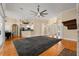 Open concept living area showcasing hardwood floors, columns, fireplace, and connection to the kitchen at 3637 Rothbury Dr, Belle Isle, FL 32812