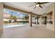 Spacious screened patio with ceiling fan that overlooks a pool and backyard, perfect for entertaining at 3637 Rothbury Dr, Belle Isle, FL 32812