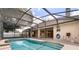 Beautiful screened-in pool with attached patio area, an idyllic spot to unwind and soak up the Florida sun at 3637 Rothbury Dr, Belle Isle, FL 32812
