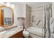 Modern bathroom features tiled shower-tub, granite vanity and attractive fixtures at 3970 Kissimmee Park Rd, St Cloud, FL 34772