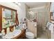 Bathroom with a walk-in shower, updated vanity, and neutral finishes at 3970 Kissimmee Park Rd, St Cloud, FL 34772