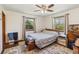 Inviting bedroom featuring two windows, vintage furnishings and ample space at 3970 Kissimmee Park Rd, St Cloud, FL 34772