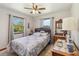 Charming bedroom with natural light, ceiling fan, and vintage furniture at 3970 Kissimmee Park Rd, St Cloud, FL 34772