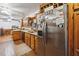 Functional kitchen featuring wood cabinets and stainless steel refrigerator at 3970 Kissimmee Park Rd, St Cloud, FL 34772
