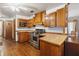 Practical kitchen featuring wood cabinets and stainless steel oven at 3970 Kissimmee Park Rd, St Cloud, FL 34772