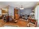 Cozy living room with hardwood floors and vintage furnishings at 3970 Kissimmee Park Rd, St Cloud, FL 34772