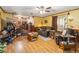 Inviting living room with wood-look floors, ceiling fan and comfortable seating at 3970 Kissimmee Park Rd, St Cloud, FL 34772
