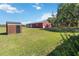 Large red outbuilding with ample storage space and yard at 3970 Kissimmee Park Rd, St Cloud, FL 34772