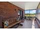 Relaxing screened porch with bench seating overlooks the lush backyard at 3970 Kissimmee Park Rd, St Cloud, FL 34772