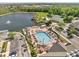 Aerial view of the community pool, lake, playground, tennis and volleyball courts at 4561 Yellowgold E Rd # 107, Kissimmee, FL 34746