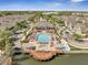 Community clubhouse and pool with lake view and lounge deck at 4561 Yellowgold E Rd # 107, Kissimmee, FL 34746