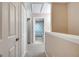 Hallway view of a bathroom with a toilet and shower with a blue curtain at 4561 Yellowgold E Rd # 107, Kissimmee, FL 34746