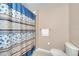 Cozy bathroom featuring a toilet and shower with a floral curtain at 4561 Yellowgold E Rd # 107, Kissimmee, FL 34746