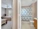 View of a bathroom and bedroom with neutral colors and carpeted floors at 4561 Yellowgold E Rd # 107, Kissimmee, FL 34746