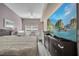 Cozy bedroom featuring plush bedding, hardwood-style floors, and modern ceiling fan at 4561 Yellowgold E Rd # 107, Kissimmee, FL 34746