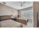 Inviting bedroom featuring two twin beds, a fan and natural light at 4561 Yellowgold E Rd # 107, Kissimmee, FL 34746