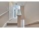Hallway with carpeted floors and neutral paint with white baseboards and doors at 4561 Yellowgold E Rd # 107, Kissimmee, FL 34746