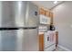 Efficient kitchen with stainless steel refrigerator and classic white appliances at 4561 Yellowgold E Rd # 107, Kissimmee, FL 34746