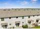 Aerial view of townhomes and the surrounding landscape at 4672 Tribute Trl, Kissimmee, FL 34746