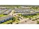 An aerial view of a neatly planned townhome community with well manicured lawns and landscaping at 4672 Tribute Trl, Kissimmee, FL 34746