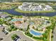 Aerial view of a resort-style community pool with lazy river, splash pad, and lounging areas at 4672 Tribute Trl, Kissimmee, FL 34746
