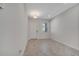 Inviting entryway with light tile floors, and a modern front door at 4672 Tribute Trl, Kissimmee, FL 34746